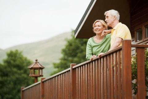 couple-looking-out-of-property